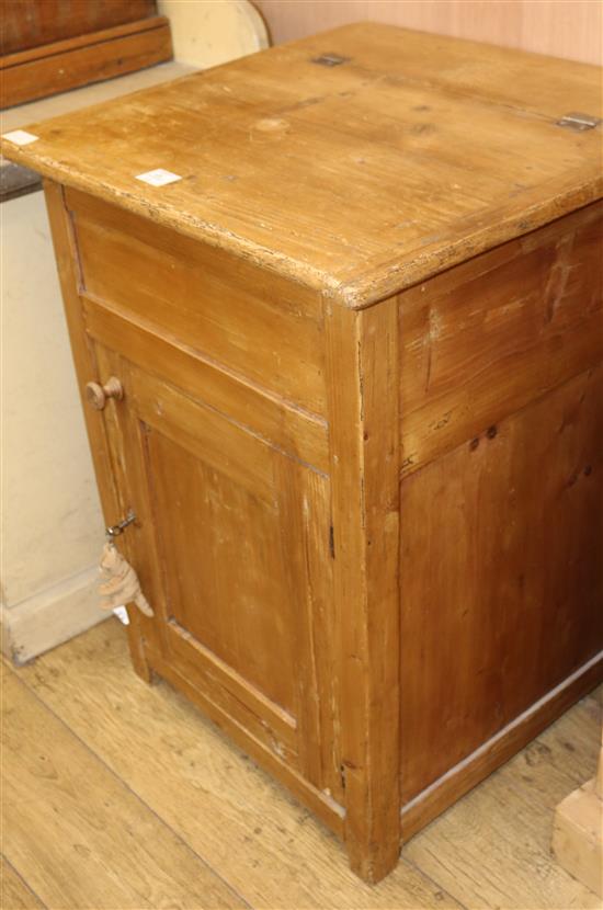 A pine cupboard with rising top, W.63cm